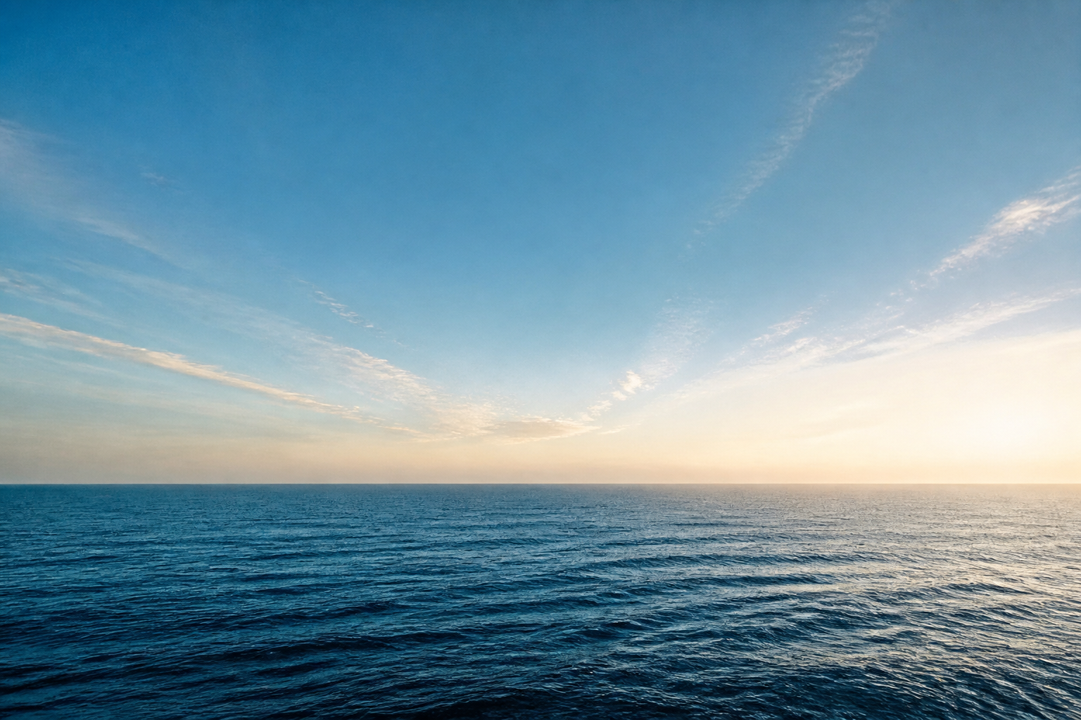 A calm Australian ocean horizon beneath a clear morning sky
